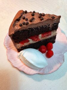 Chocolate fudge cake with chocolate mousse and raspberries